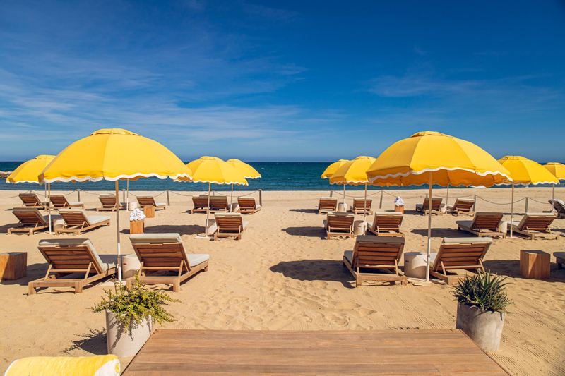 Yellow umbrellas and loungers on the beach